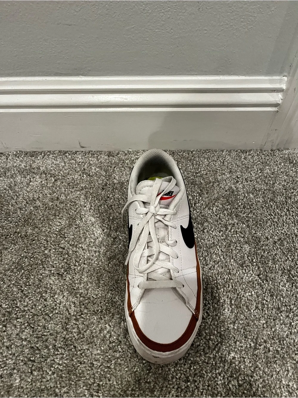 Nike women’s White Sneakers with Black Swoosh and Brown Trim